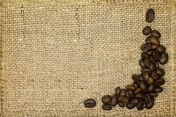 background coffee beans on sackcloth closeup
