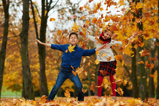 boy and girl in autumn park