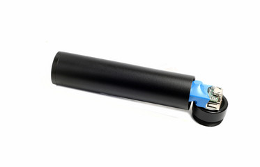 external battery in a black metal cylinder