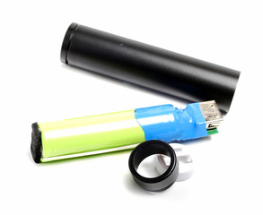 external battery in a black metal cylinder