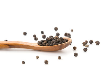 Black pepper with wood spoon
