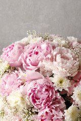 Floral arrangement with pink peonies, white chrysanthemums and g