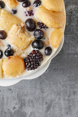 Blueberry and blackberry cheesecake with ladyfingers