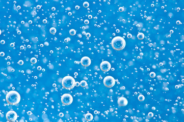 Macro Oxygen bubbles in blue clear water
