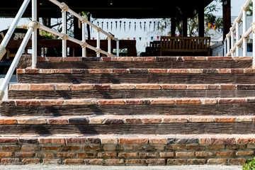 Sloping brick concrete stair steps