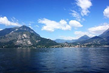 Lake Como view towards Menaggio under blue sky in Lombardy Italy 