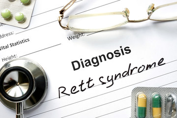Diagnosis Rett syndrome, pills and stethoscope.