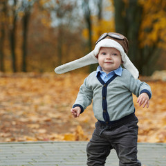 little boy in helmet pilot portrait