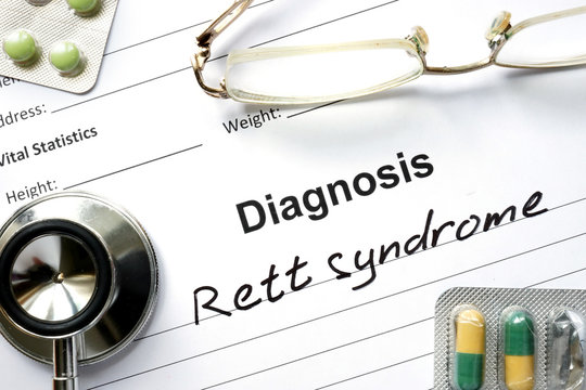 Diagnosis Rett syndrome, pills and stethoscope.
