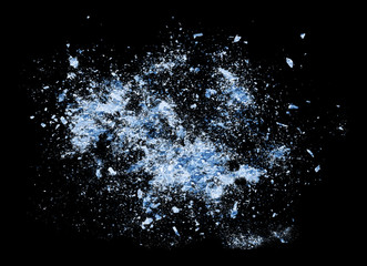 Big bang Abstract blue Ice crash explosion parts on black background. Collision, suspension crystal ice cubes damage.