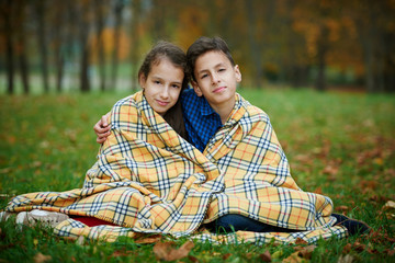 boy and girl in autumn park