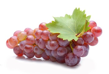 Red grapes with leaves isolated on white background