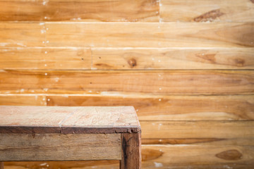 Empty top wooden table and wooden wall background