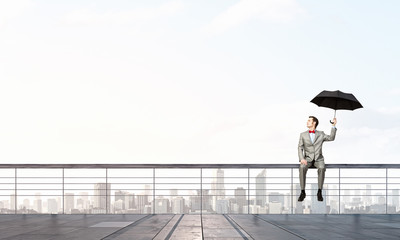 Businessman with umbrella