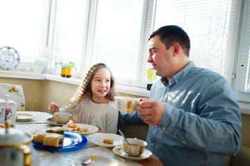 family has breakfast in the morning