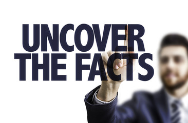 Business man pointing the text: Uncover the Facts