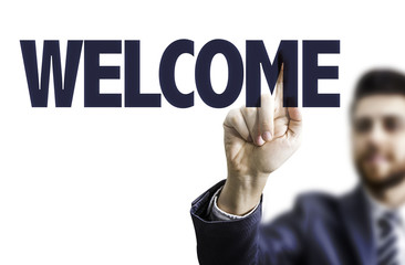 Business man pointing the text: Welcome