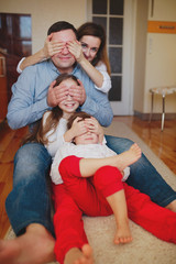 happy family at home on the floor