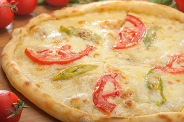 Turkish pide with cheese, tomatoes and peppers