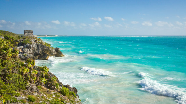 Ancient Mayan ruins in Tulum on the beach of Caribbean turquoise sea 