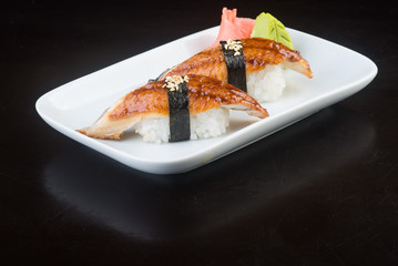 japanese cuisine. sushi unagi on the background