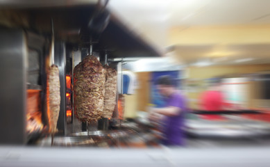 Turkish doner kebab in restaurant. Blur motion interior.