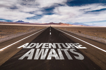 Adventure Awaits written on desert road