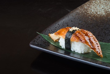 japanese cuisine. sushi unagi on the background