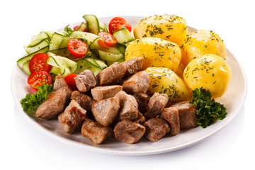 Grilled meat with boiled potatoes and vegetables 
