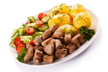 Grilled meat with boiled potatoes and vegetables 