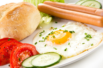 Breakfast - fried egg and sausages 