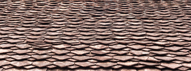 Old roof tiles on the roof of an old house 