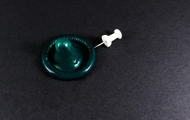 Condom and a Pin Prick