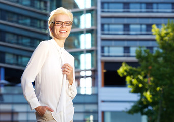 Confident young woman smiling with glasses