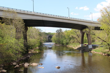 Fototapeta na wymiar Underside of a Bridge Over Water