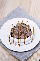 White meringues with brown chocolate stripes