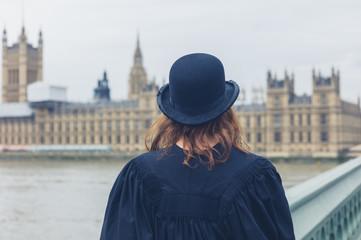 Woman with bowler hat at hopuses of parliament