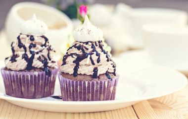 Chocolate Cupcake with chocolate frosting on the table