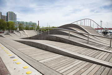 TORONTO - AUGUST 8, 2015: The Toronto Waterfront Wavedecks are a series of wooden structures constructed on the waterfront of Toronto, Canada as part of the revitalization of the central waterfront. - obrazy, fototapety, plakaty