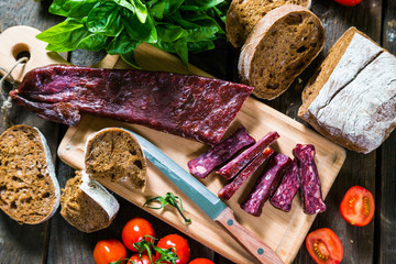 Armenian sudzhuk. Sausage, bread and cherry tomatoes