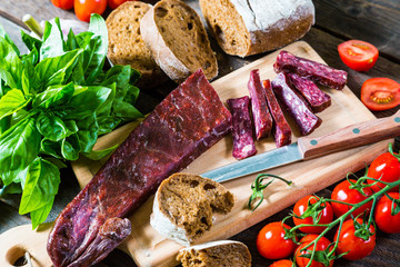 Armenian sudzhuk. Sausage, bread and cherry tomatoes