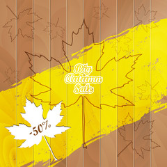 Big Autumn Sale Autumnal Maple Leaf on a wooden background