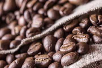 Coffee seed on linen fabric texture.