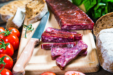 Armenian sudzhuk. Sausage, bread and cherry tomatoes