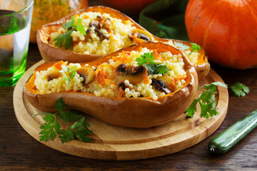 Pumpkin stuffed with couscous with grilled mushrooms.