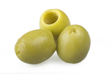 Pitted green olives close up on the white