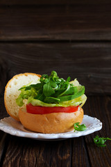 Dietary vegetable burger with avocado and salad.