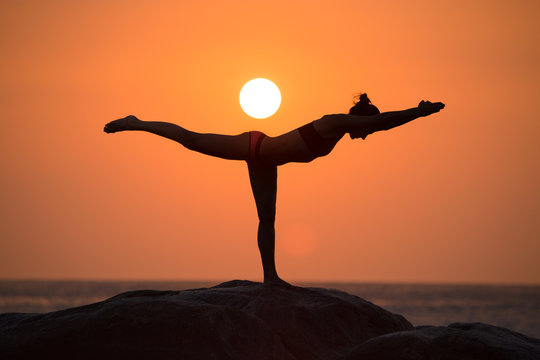 Warrior pose on sunset