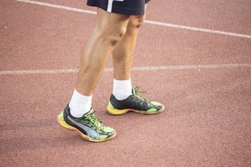 Fototapeta premium Sprinter at track, close up of legs and shoes.