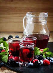 Fresh berry drink with blueberries, blackberries and raspberries